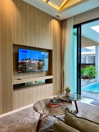 Luxurious living room with pool view, modern decor, and elegant furniture, perfect for relaxation and entertainment.