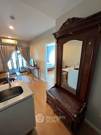 Charming apartment interior with elegant wooden furniture and cozy living space, perfect for modern living.