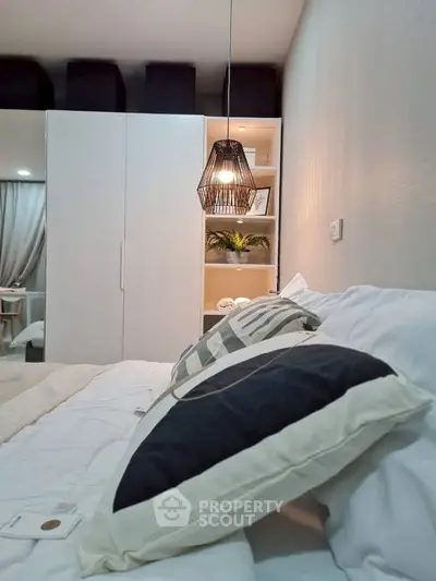 Cozy bedroom with modern lighting and stylish decor