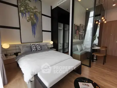 Luxurious modern bedroom with elegant decor and cozy seating area, perfect for relaxation and comfort.