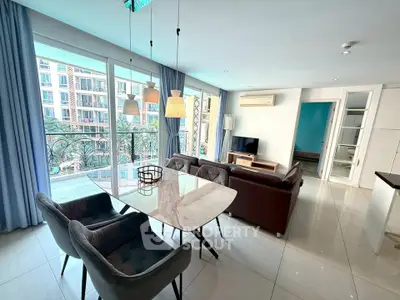 Spacious living room with modern decor and balcony view in luxury apartment