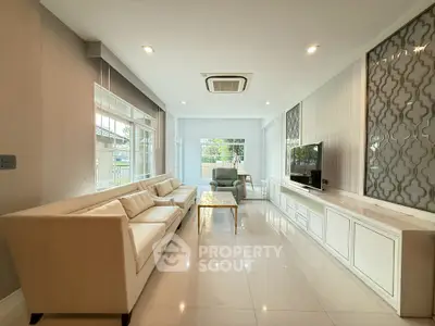 Spacious modern living room with elegant decor and ample natural light