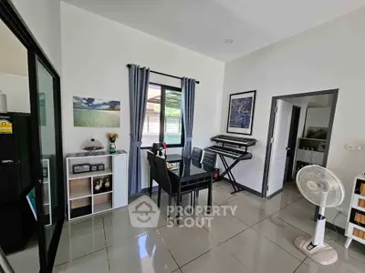 Modern living room with sleek furniture and musical instruments, perfect for creative living.