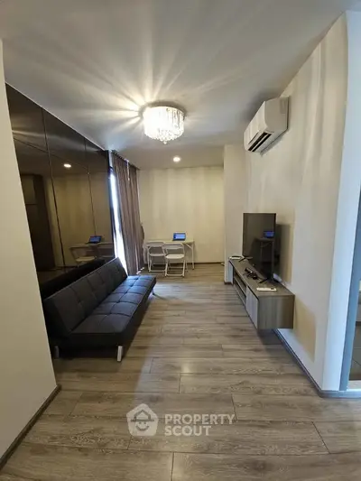 Modern living room with sleek furniture and elegant lighting