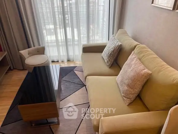 Stylish living room with modern sofa and elegant decor in a high-rise apartment.