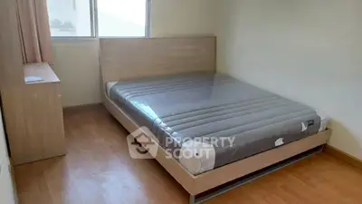 Cozy bedroom with new mattress and wooden furniture, perfect for restful nights.