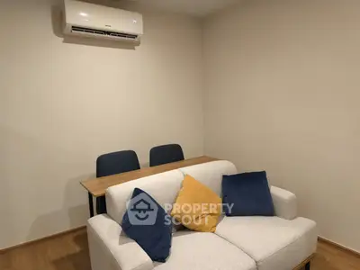 Cozy living room with modern air conditioning and stylish sofa