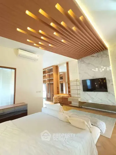 Luxurious modern bedroom with stylish ceiling design and marble accent wall