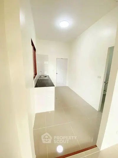 Bright minimalist kitchen with sleek countertops and modern design