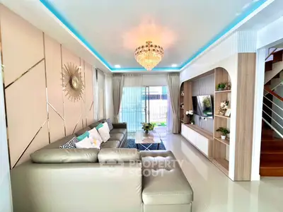 Luxurious modern living room with elegant chandelier and stylish decor