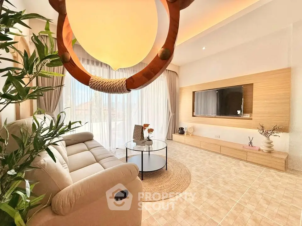 Spacious living room with modern decor and natural light