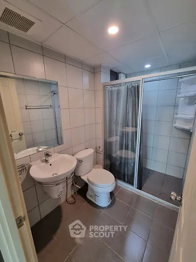 Modern bathroom with shower and sleek tile design