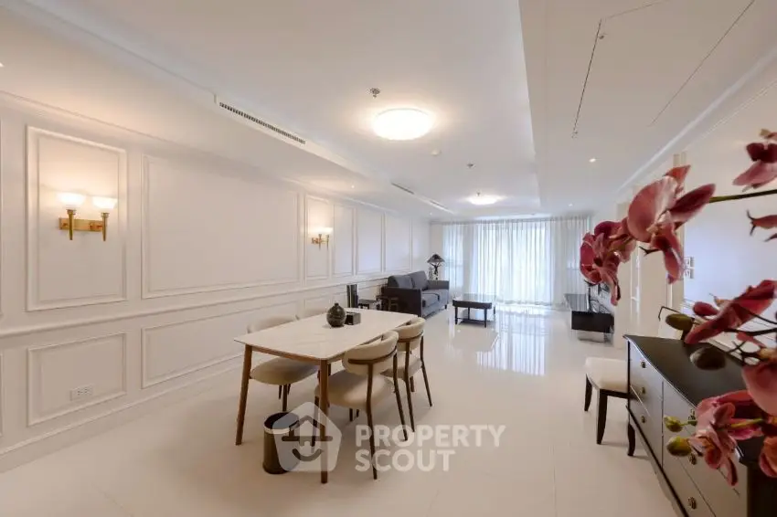 Spacious modern living room with elegant dining area and natural light