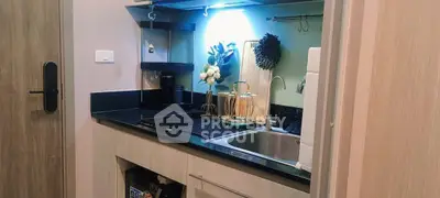 Modern compact kitchen with sleek design and stylish decor