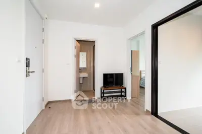 Modern apartment interior with open layout and sleek wooden flooring