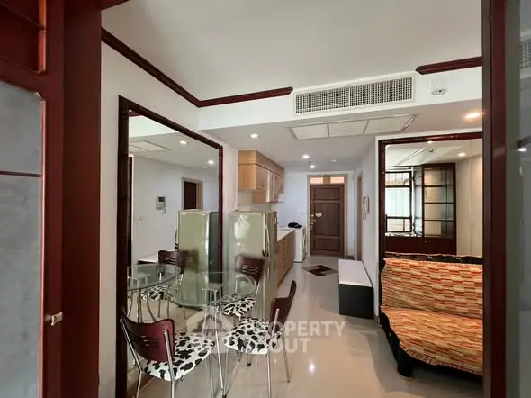 Stylish apartment interior with modern furniture and open layout, featuring a cozy dining area and chic decor.