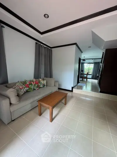 Spacious living room with modern decor and natural light