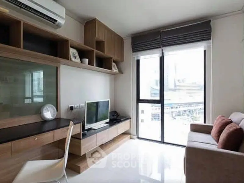 Modern living room with sleek furniture and large window view