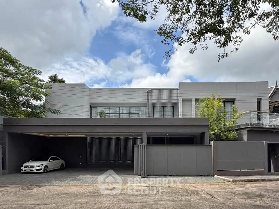 Modern luxury home exterior with sleek design and spacious driveway
