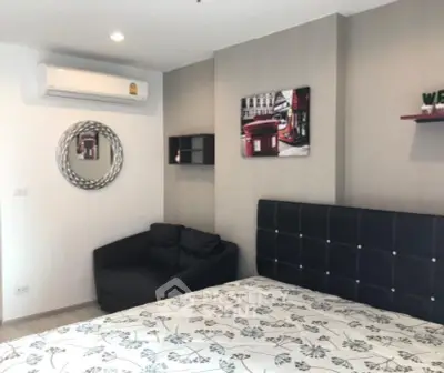 Modern bedroom with stylish decor and comfortable furnishings in a cozy apartment.