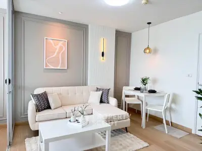 Stylish modern living room with elegant decor and cozy dining area