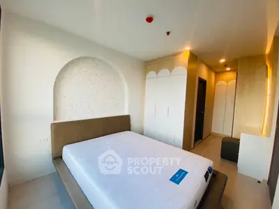 Modern bedroom with stylish decor and ample storage space