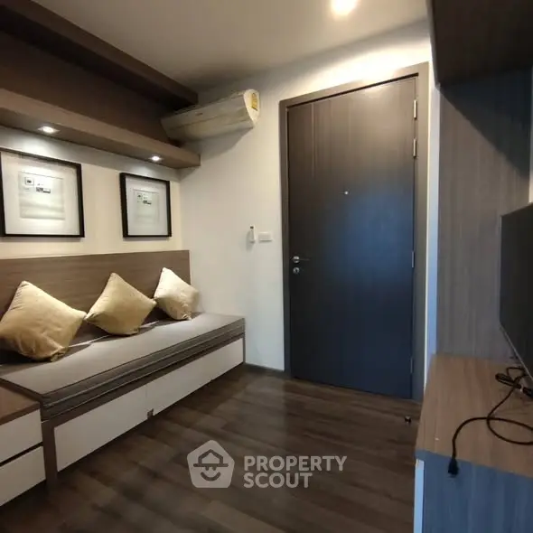 Modern living room with sleek design and cozy seating area