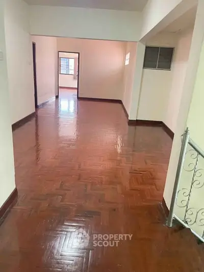 Spacious interior with polished wooden floors and natural light