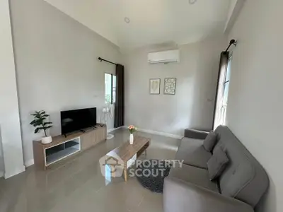 Modern living room with sleek furniture and natural light