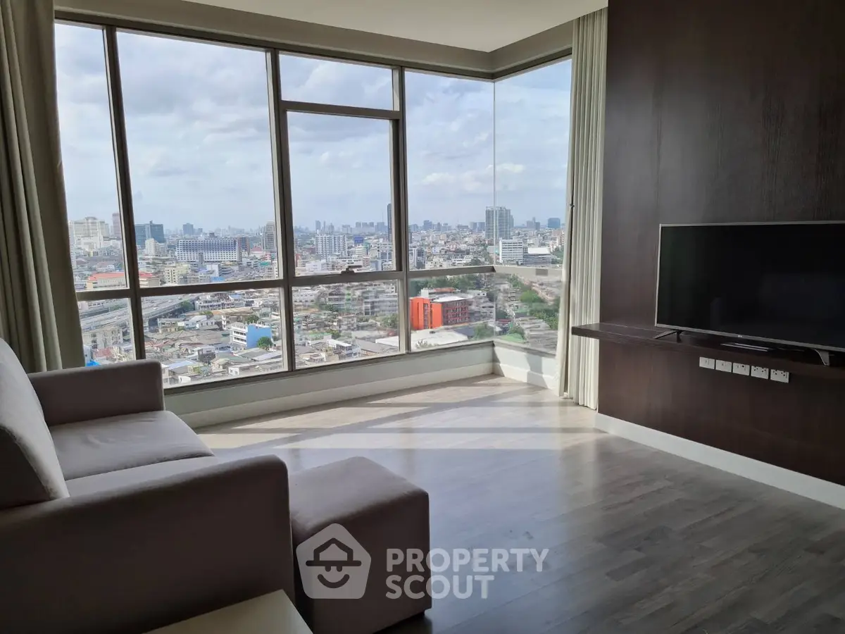 Modern living room with panoramic city view and sleek furnishings