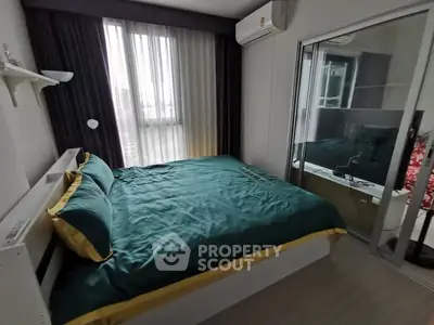 Cozy bedroom with modern decor and large window in stylish apartment