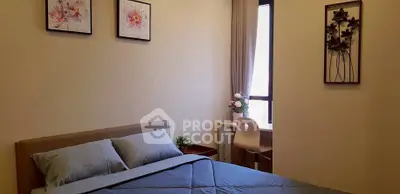 Cozy bedroom with elegant decor and natural light, perfect for relaxation and comfort.