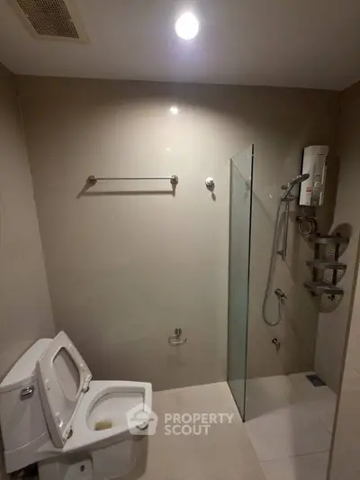 Modern bathroom with glass shower and sleek fixtures