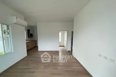 Spacious modern interior with wooden flooring and air conditioning