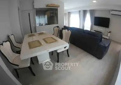 Modern living room with elegant dining area and stylish furniture