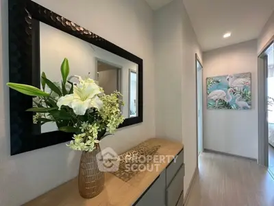 Stylish hallway with elegant decor and floral arrangement in modern apartment