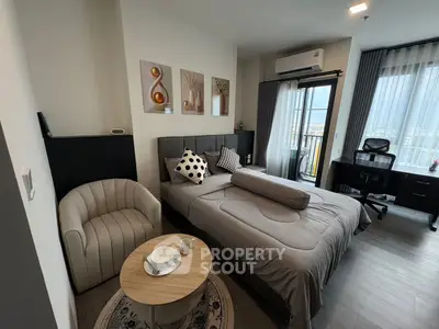 Modern bedroom with stylish decor and city view from window