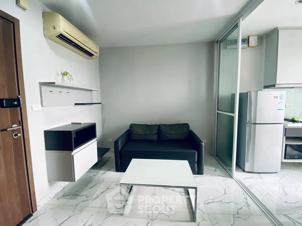 Modern living room with sleek furniture and air conditioning in a stylish apartment.