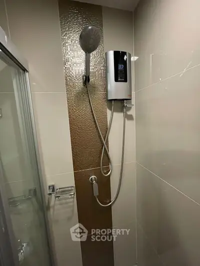 Modern bathroom shower with sleek design and digital water heater