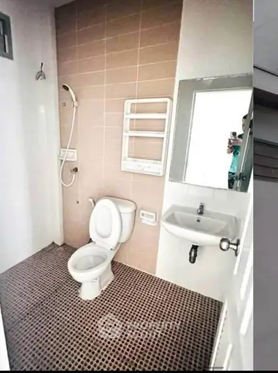 Modern bathroom with sleek fixtures and stylish tile flooring, perfect for contemporary living.