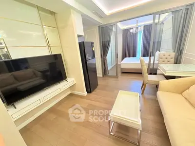 Modern living room with open layout and elegant furnishings in a stylish apartment.