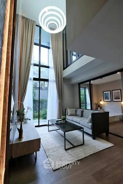 Luxurious modern living room with high ceilings and elegant decor