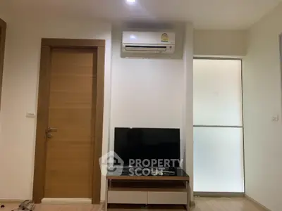 Modern living room with air conditioning and TV setup