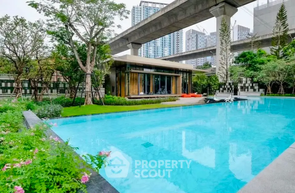 Luxurious urban oasis with a sparkling pool and modern architecture, perfect for relaxation and city living.