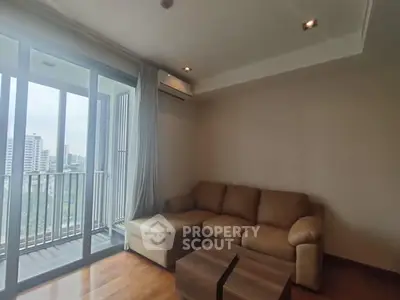 Modern living room with cozy sofa and balcony view in urban apartment