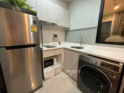 Modern kitchen with stainless steel appliances and sleek cabinetry