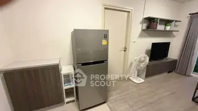 Modern living room with sleek fridge and stylish TV setup