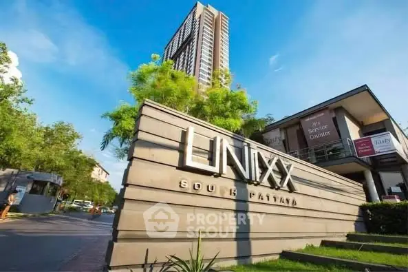 Modern high-rise building with lush greenery at Unixx South Pattaya