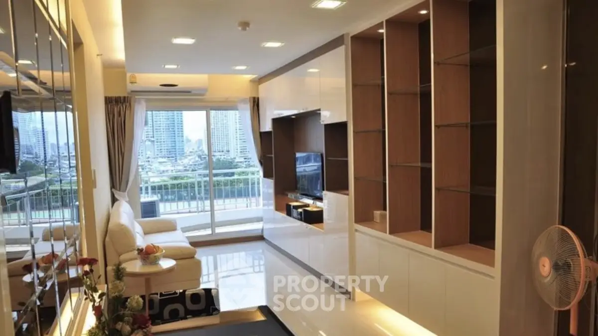 Modern living room with city view and sleek built-in shelving.