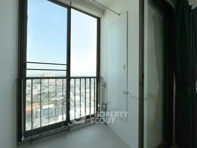 Modern apartment balcony with stunning city view and sleek design.